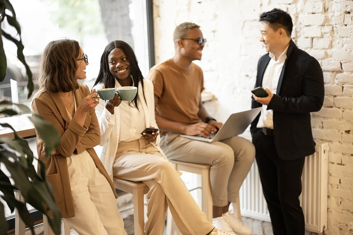 Professionals casually networking after work over coffees